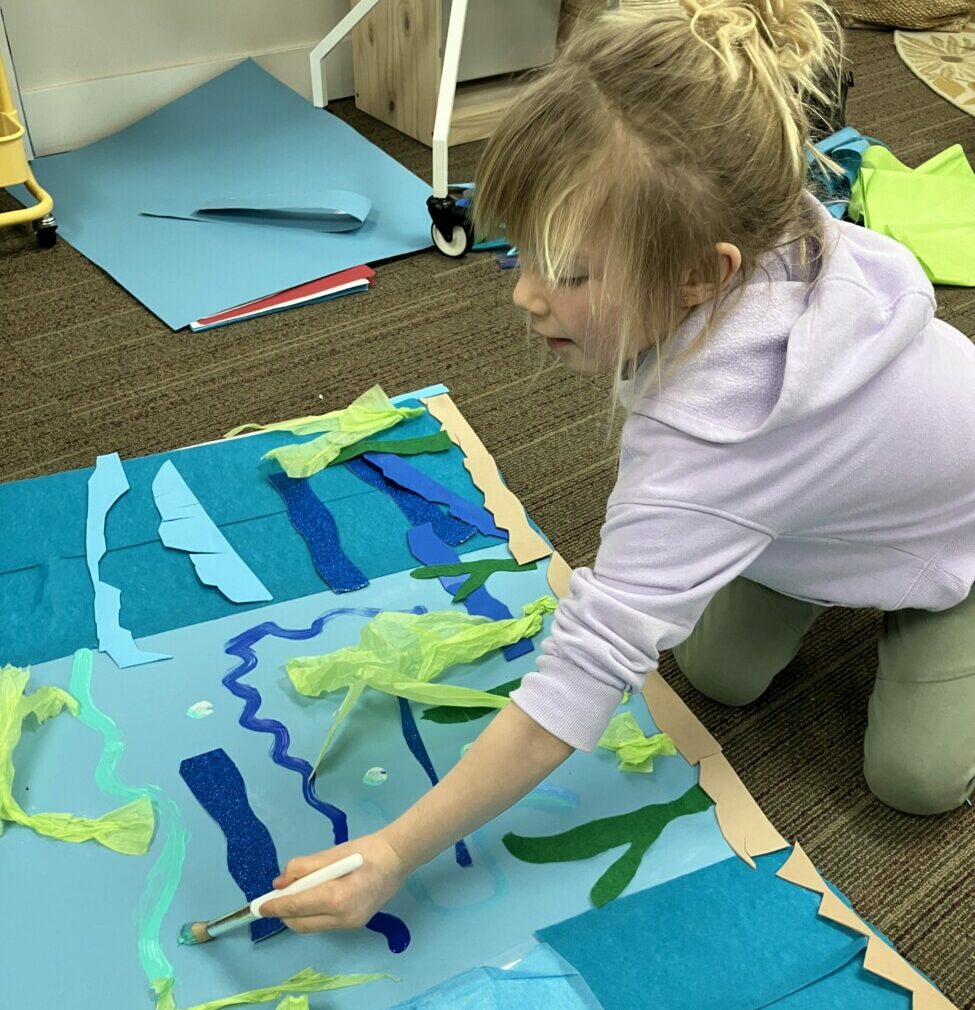 student performing artistic activity on floor