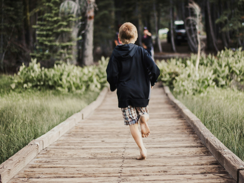 Child running along pathway