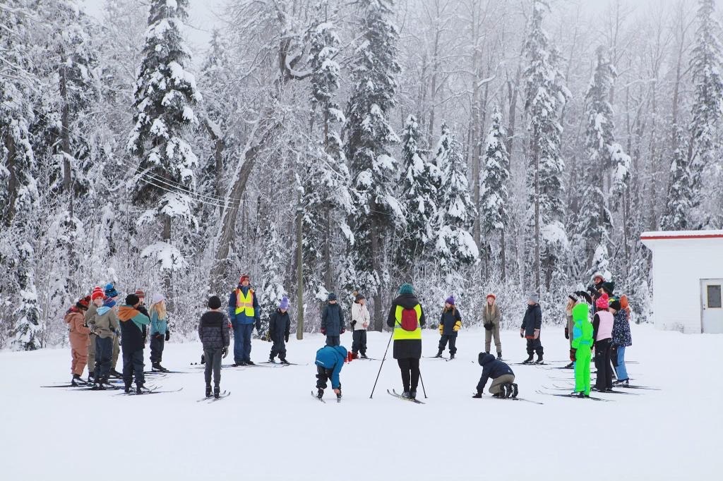 students outside in snowy forest