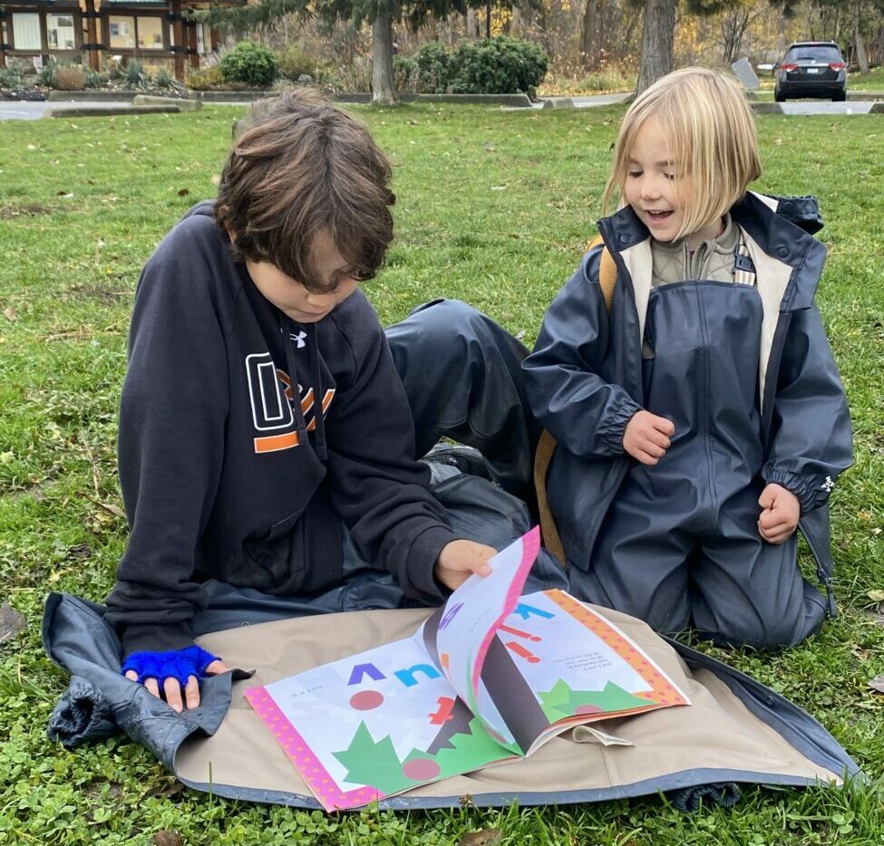 students siting on grass