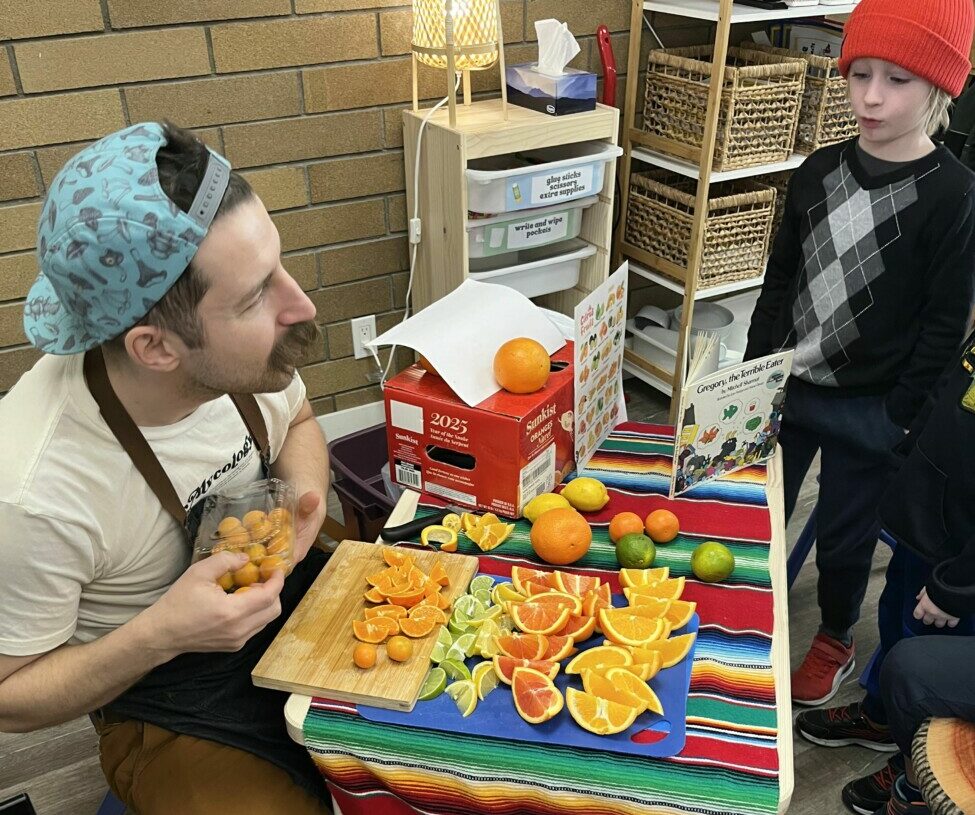 student and teacher at table with food